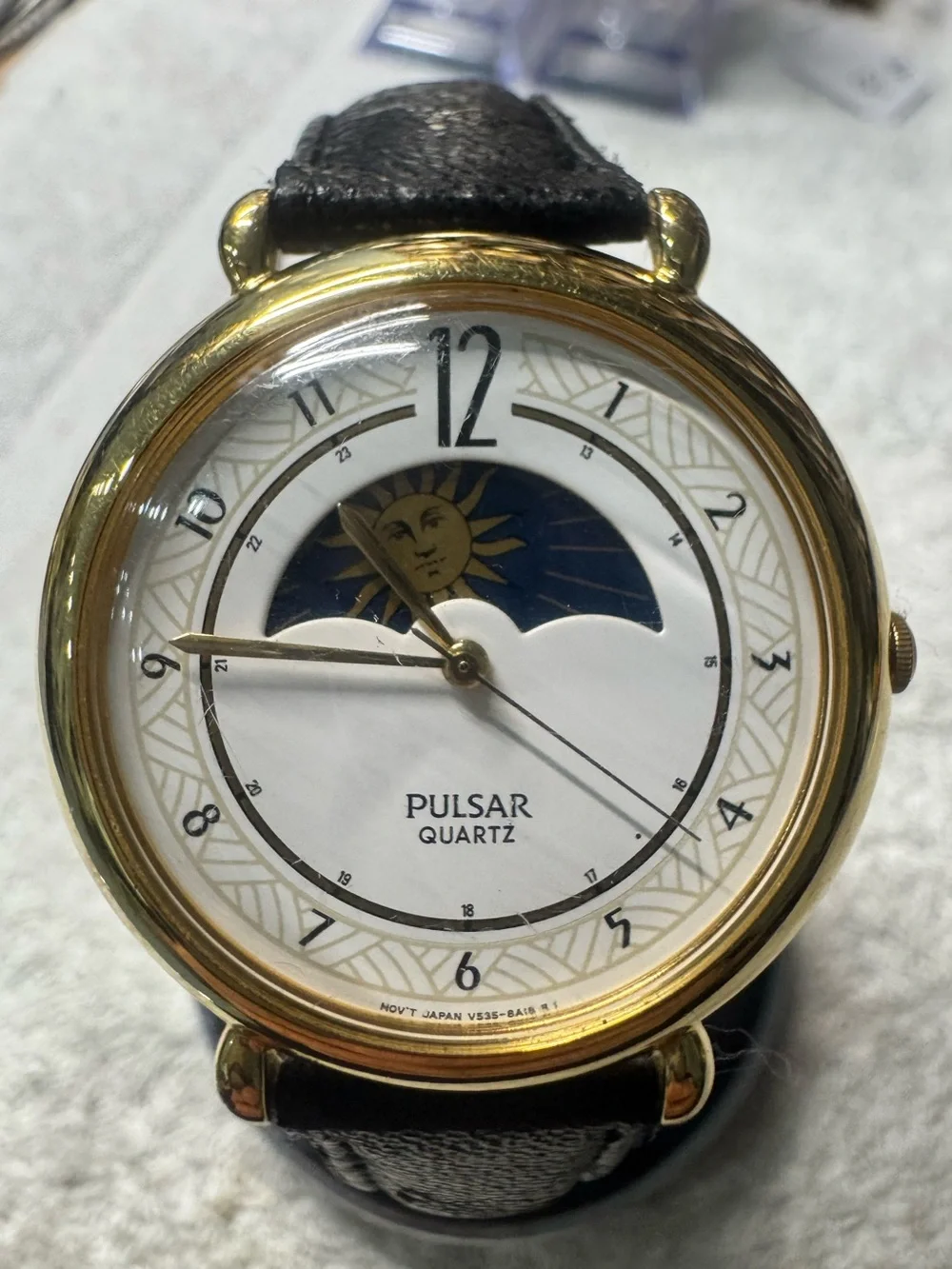 Pulsar Gold Tone Watch with White Dial and Black Strap